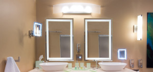 Hotel bathroom with lighted magnified mirrors