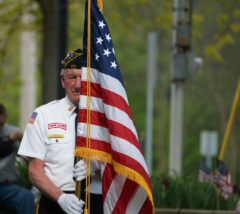 Veteran with American flag